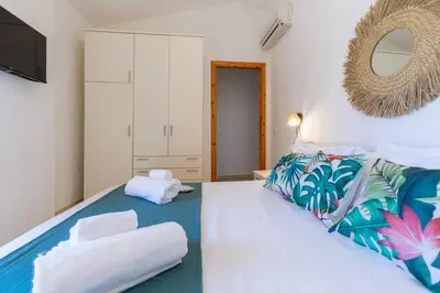 Letto o letti in una camera di Porto Pino, Garden and Pool SouthSardiniaHolidays