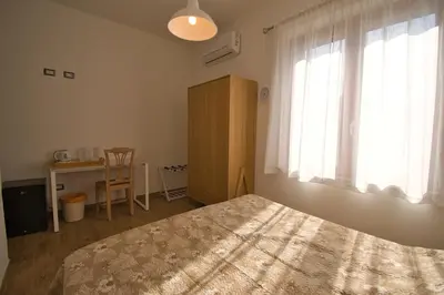 Letto o letti in una camera di Dommu Livia