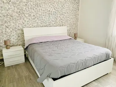 Letto o letti in una camera di Luce