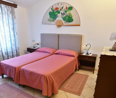 Letto o letti in una camera di B&B Mitzixeddas