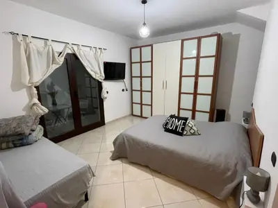 Letto o letti in una camera di Camere Aeroporto Cagliari Elmas