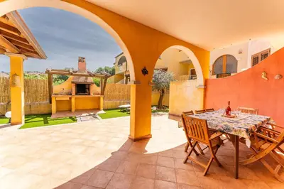 Patio o area all'aperto di Airin house with garden, Villasimius center SouthSardiniaHolidays