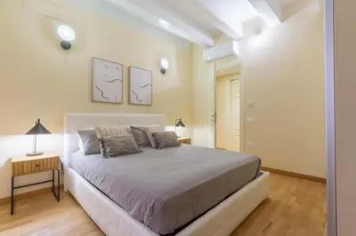 Letto o letti in una camera di Suite Martini Castello - Boutique Apartments