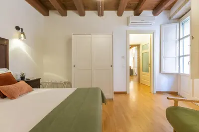 Letto o letti in una camera di Suite Martini Castello - Boutique Apartments