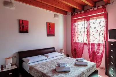 Letto o letti in una camera di Casa Azzurra