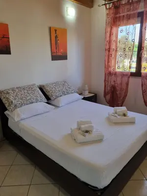Letto o letti in una camera di Casa Azzurra