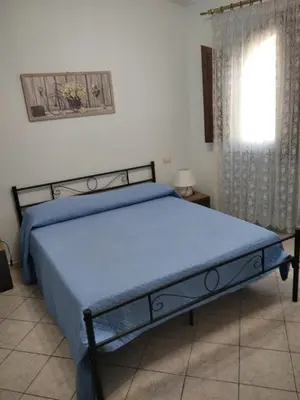 Letto o letti in una camera di Casa Elena