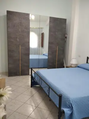 Letto o letti in una camera di Casa Elena