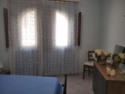 Letto o letti in una camera di Casa Elena