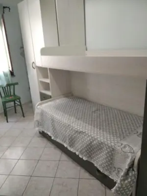 Letto o letti in una camera di Casa Elena