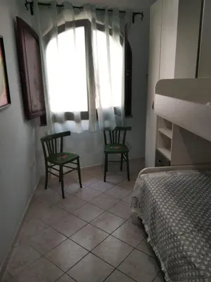 Letto o letti in una camera di Casa Elena