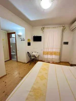 Letto o letti in una camera di Note Sulla Piazza