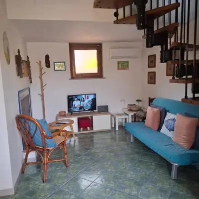 TV o dispositivi per l'intrattenimento presso Casa blu Arbatax con giardino e terrazza