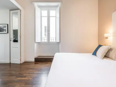 Letto o letti in una camera di PLEY Cagliari Boutique Rooms