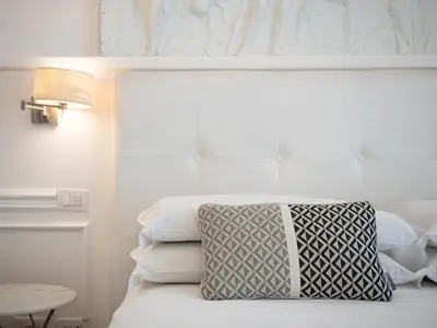 Letto o letti in una camera di PLEY Cagliari Boutique Rooms