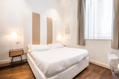 Letto o letti in una camera di PLEY Cagliari Boutique Rooms