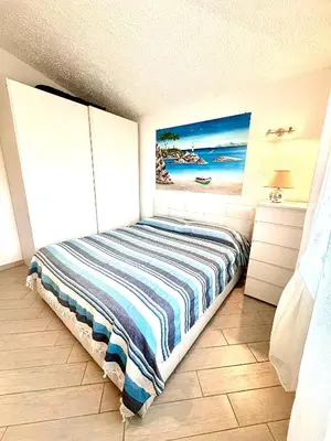 Letto o letti in una camera di Suites Dreams Sardegna Vista Mare CostaRei