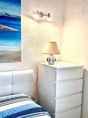 Letto o letti in una camera di Suites Dreams Sardegna Vista Mare CostaRei