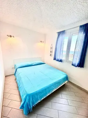 Letto o letti in una camera di Suites Dreams Sardegna Vista Mare CostaRei