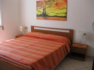 Letto o letti in una camera di Appartamento elegante e confortevole