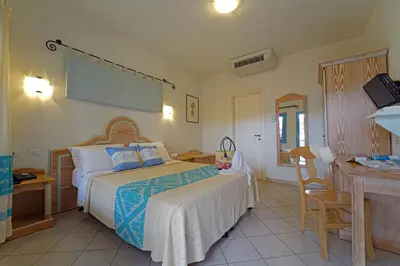 Letto o letti in una camera di Colostrai Hotel Club