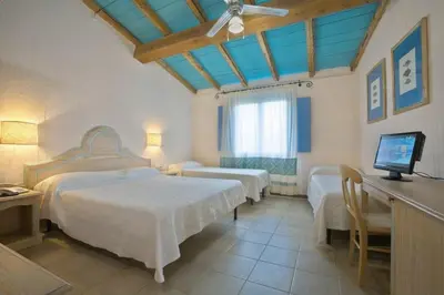 Letto o letti in una camera di Colostrai Hotel Club