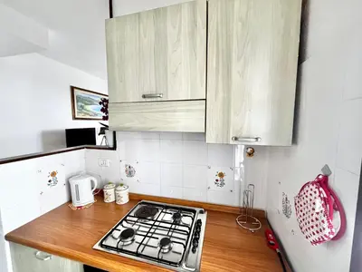 Cucina o angolo cottura di Casa Tina By La Via Del Mare Viaggi e Vacanze