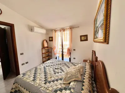 Letto o letti in una camera di Casa Tina By La Via Del Mare Viaggi e Vacanze
