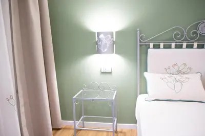 Letto o letti in una camera di Berry Rooms