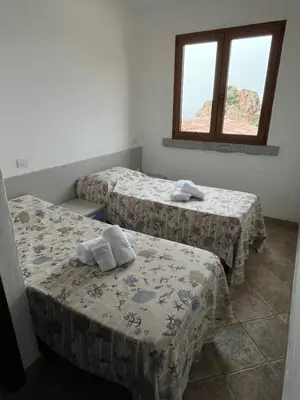 Letto o letti in una camera di La finestra sul mare - Tanca Piras