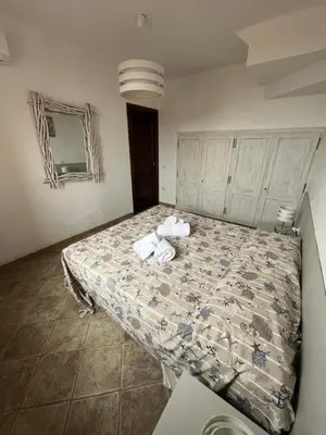 Letto o letti in una camera di La finestra sul mare - Tanca Piras
