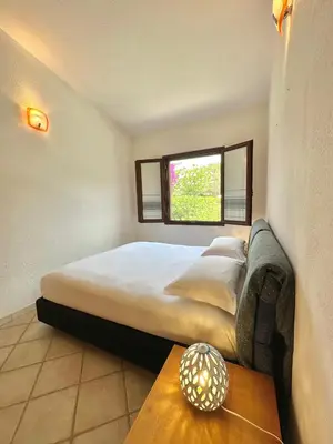 Letto o letti in una camera di Domus Mary Cala Caterina Apartment with sea view