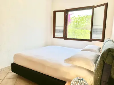 Letto o letti in una camera di Domus Mary Cala Caterina Apartment with sea view