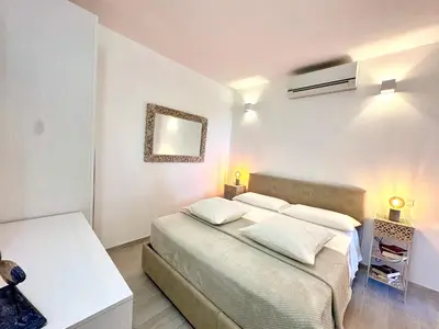 Letto o letti in una camera di Domus Angelica Apartment Charmant with sea view Villasimius