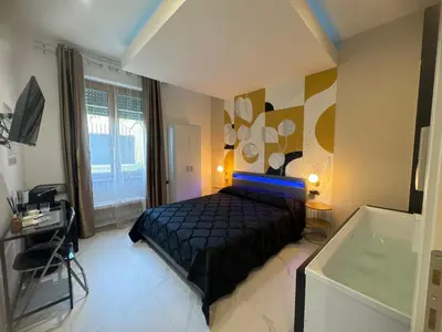 Letto o letti in una camera di Cagliari Love Suite