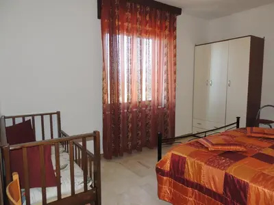 Letto o letti in una camera di Appartamento Mariolu 3