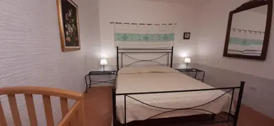 Letto o letti in una camera di Casa Grazia e Enrico