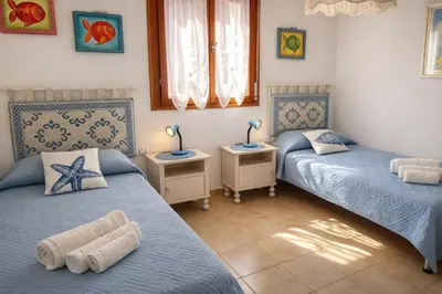 Letto o letti in una camera di Casa Marina