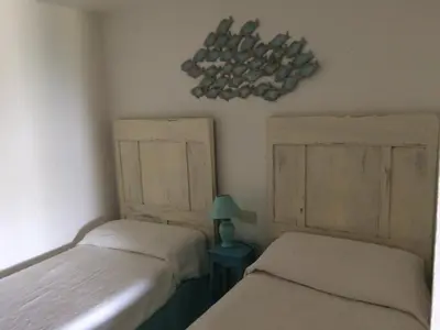 Letto o letti in una camera di Villa Milli