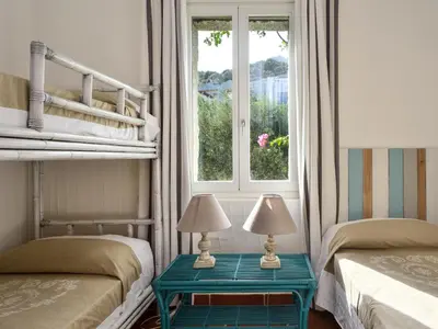 Letto o letti in una camera di Casa Li Conchi H