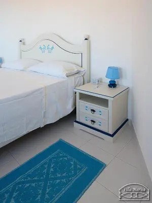 Letto o letti in una camera di Villa Marisa