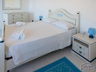 Letto o letti in una camera di Villa Marisa