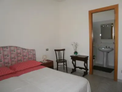 Letto o letti in una camera di Scalas House
