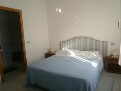 Letto o letti in una camera di Scalas House