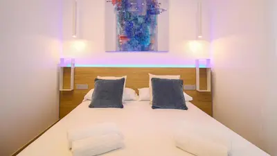 Letto o letti in una camera di Galleria Roma Art Guesthouse