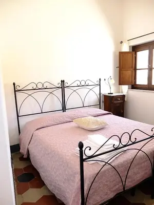 Letto o letti in una camera di Casa Camilla Sardegna