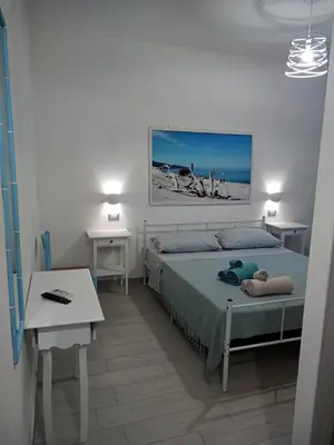 Letto o letti in una camera di B&B S'Incantu