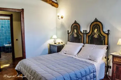 Letto o letti in una camera di Il Borgo dell'Arcangelo