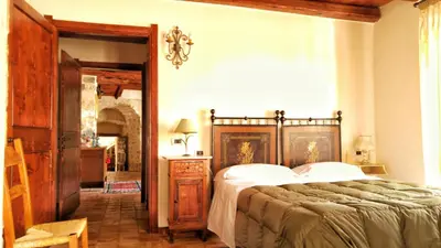 Letto o letti in una camera di Il Borgo dell'Arcangelo