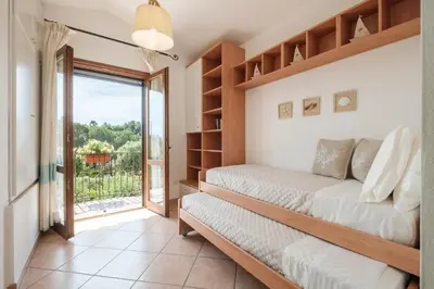 Letto o letti in una camera di Mare e Centro 5 min auto - con Wi-fi, Netflix e A-C